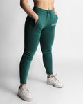 Right side angle of LYFTLYFE React joggers in green showing tapered leg and pocket detail. 