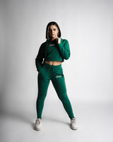Athletic full-body pose featuring React hoodie and joggers in matching green color. 