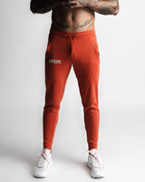 Front view of Function joggers in red with LYFTLYFE logo and tapered fit. 