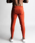 Back view of Function joggers in red showing dual rear pockets and clean lines. 