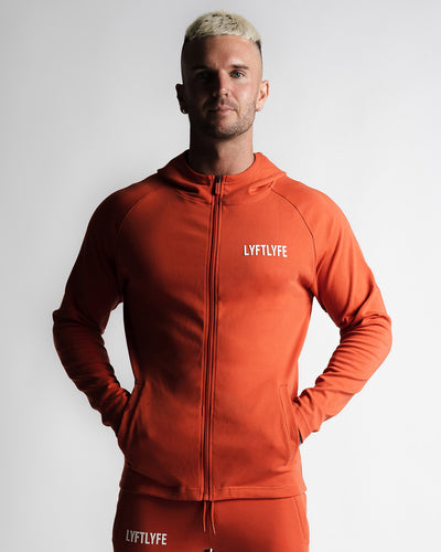 Men's hoodie in red left side angle with LYFTLYFE logo and full zip design.