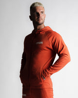 Men's hoodie in red right side angle with LYFTLYFE logo and full zip design.