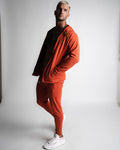 Full-body outfit with Function hoodie unzipped, paired with matching Function joggers in red. 