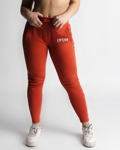 Full front view of LYFTLYFE React joggers in red with high-waist fit. 