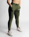 Right side view of green joggers showing contour fit and high-rise waistband. 