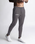 Right Side view of men’s Function joggers in grey with hidden zipper pocket detail. 