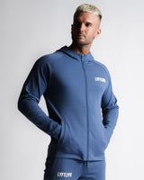 Men's slim-fit hoodie in blue right side profile with zipper and ergonomic seamlines.