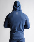 Men's athletic blue hoodie back profile highlighting muscle-contour fit.