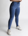 Right side angle of LYFTLYFE React joggers in blue showing tapered leg and pocket detail.
