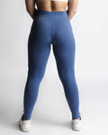 Back view of women’s joggers in blue, sculpted athletic fit.