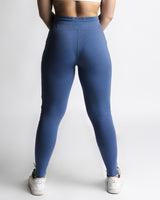 Back view of women’s joggers in blue, sculpted athletic fit.