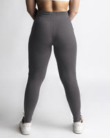Rear view of womens joggers in grey showing contour fit and high-rise waistband. 