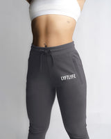 Elastic waistband and drawcord detail on LYFTLYFE women's joggers in grey. 
