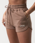 Detailed shot of the side pocket and plush material on women’s taupe Balance Shorts with a high-waisted fit.