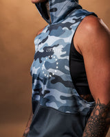 Close-up shot of the Lyftlyfe branding on the blue camo sleeveless hoodie, designed for style and performance.