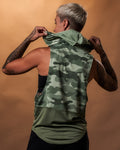 Back view of women’s green camo sleeveless hoodie with a loose fit and moisture-wicking triple-blend fabric for comfort.