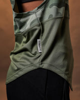 Close-up view of the Lyftlyfe side tag on the Women’s green camo Sleeveless Hoodie, showcasing its signature branding.