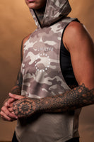 Detailed shot of the Lyftlyfe chest logo on the Women’s Command Sleeveless Hoodie in brown camo, emphasizing clean aesthetics and premium quality.