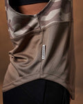 Detailed shot of the LYFTLYFE slogan ‘Dominate Adversity’ side flag tag on the brown camo sleeveless hoodie.