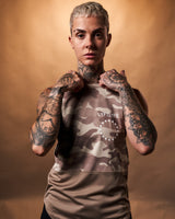 Women’s Command sleeveless shirt in brown camo, highlighting its athletic design and premium performance fabric.