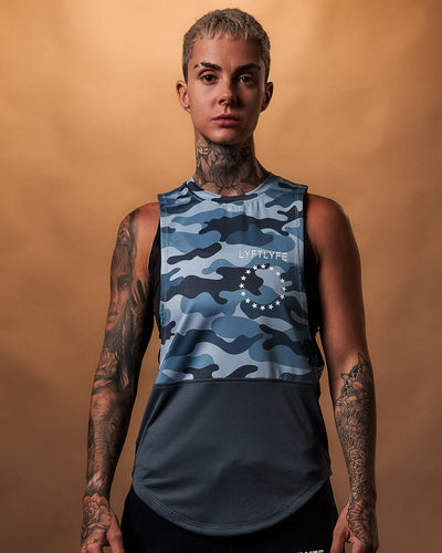 Women’s blue camo sleeveless tank top with a white Lyftlyfe logo on the left chest.