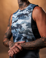 Close-up of the white Lyftlyfe logo on the left chest of the Women’s Command Cut Sleeve tank in blue camo.