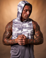 Men’s sleeveless gym hoodie in purple camo, featuring a moisture-wicking design and a lightweight hood for ultimate comfort.