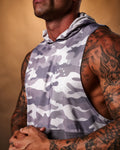 Close-up of the white Lyftlyfe logo on the left chest of the Men’s Command Sleeveless Hoodie tank in purple camo.