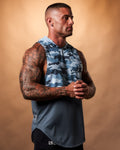 Men’s sleeveless gym hoodie in blue camo, displayed from the right side, highlighting its curved hem and durable triple-blend fabric.