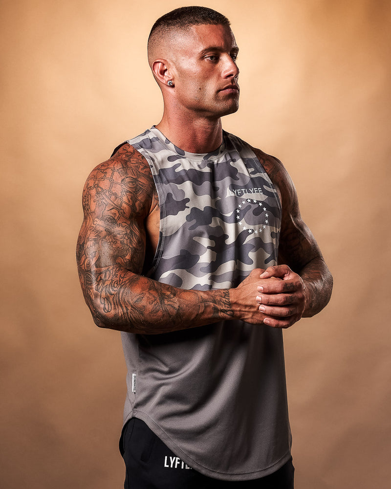 Mens Tank top in 2 panels. Top panel is camo and the bottom is Ash gray.