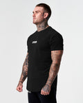 Men’s fitted t-shirt in black, shown from the left side, designed for comfort, movement, and moisture-wicking performance.