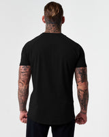 Back view of Men’s fitted t-shirt in black, designed for comfort, movement, and moisture-wicking performance.