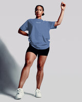 Oversized Contour Women’s Tee in blue, featuring a moisture-wicking cotton blend and soft crew neckline for all-day comfort.