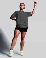 Front view of the Contour Women’s Oversized Tee in dark grey, designed with high-performance cotton and a soft, breathable second-skin feel.