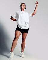 Women’s Contour Oversized Tee in white, crafted with wrinkle-resistant fabric and a sleek Lyftlyfe 3D rubberized chest logo.
