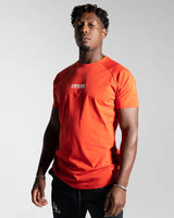 Left side view of the Contour Men’s T-Shirt in red, crafted from moisture-wicking, high-performance cotton with a second-skin feel.