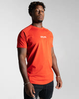 Right side view of the Contour Men’s T-Shirt in red, crafted from moisture-wicking, high-performance cotton with a second-skin feel.