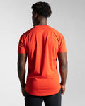 Back view of the Contour Men’s T-Shirt in red, showing its fitted cut, wrinkle-resistant fabric, and smooth stitching details.