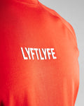 Close-up of the 3D rubberized LYFTLYFE logo on the chest of the Contour Men’s T-Shirt in red, adding a premium touch.