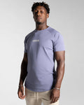 Left side view of Contour Men’s T-Shirt in purple, showing its fitted cut, wrinkle-resistant fabric, and smooth stitching details.