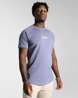 Right side view of Contour Men’s T-Shirt in purple, showing its fitted cut, wrinkle-resistant fabric, and smooth stitching details.