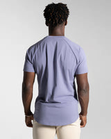 Back view of Contour Men’s T-Shirt in purple, showing its fitted cut, wrinkle-resistant fabric, and smooth stitching details.