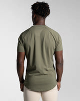 Back view of the Contour Men’s T-Shirt in green, showing its fitted cut, wrinkle-resistant fabric, and smooth stitching details.