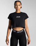 Women’s cropped Drill T-shirt in black, featuring a regular fit, moisture-wicking cotton blend, and a 3D rubberized Lyftlyfe logo.