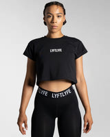 Women’s cropped Drill T-shirt in black, featuring a regular fit, moisture-wicking cotton blend, and a 3D rubberized Lyftlyfe logo.