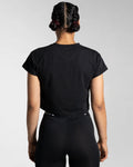 Drill Women’s Crop T-shirt in black, displayed from the back, showcasing its fitted cut, soft-stretch fabric, and moisture-wicking properties.
