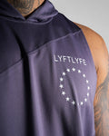 Close-up of the white Lyftlyfe logo on men’s purple hooded tank top.
