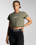 Fitted Drill Women’s Tee in olive green shown from the left side, featuring advanced cotton blend fabric and a stylish cropped design.