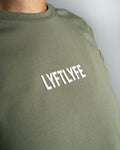 Close-up of the Lyftlyfe logo on the Contour Women’s Oversized Tee in green, crafted with precision and high-quality materials.
