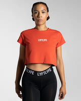 Perfectly cropped Drill Women’s Tee in red, featuring a soft crew neckline and breathable moisture-wicking cotton blend.